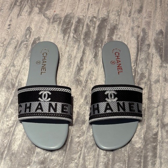 CHANEL Shoes - CHANEL Black and White Logo Slide Sandals